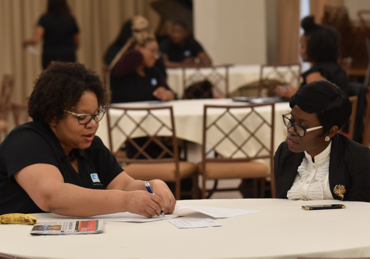 Essilor of America employee and Southern University Alumna, Lashanda Reed Larry, (left) consults with Doctoral student, Ruth Mbah during the Career Advice &amp; Slick hosted by Career Services held on Tuesday, February 19. inside the Royal Cotillion Ballroom(Diamond Butler/DIGEST)