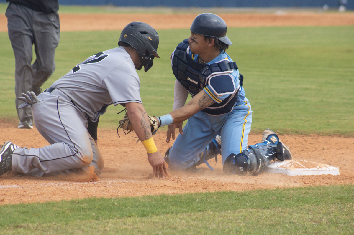 Sophomore Catcher William Nelson tags out UAPB Junior Outfielder Bryce Roesch, in Saturday&#8217;s SWAC series at Lee Hines Field on Saturday, March 9. (Devin Hadrick/DIGEST)