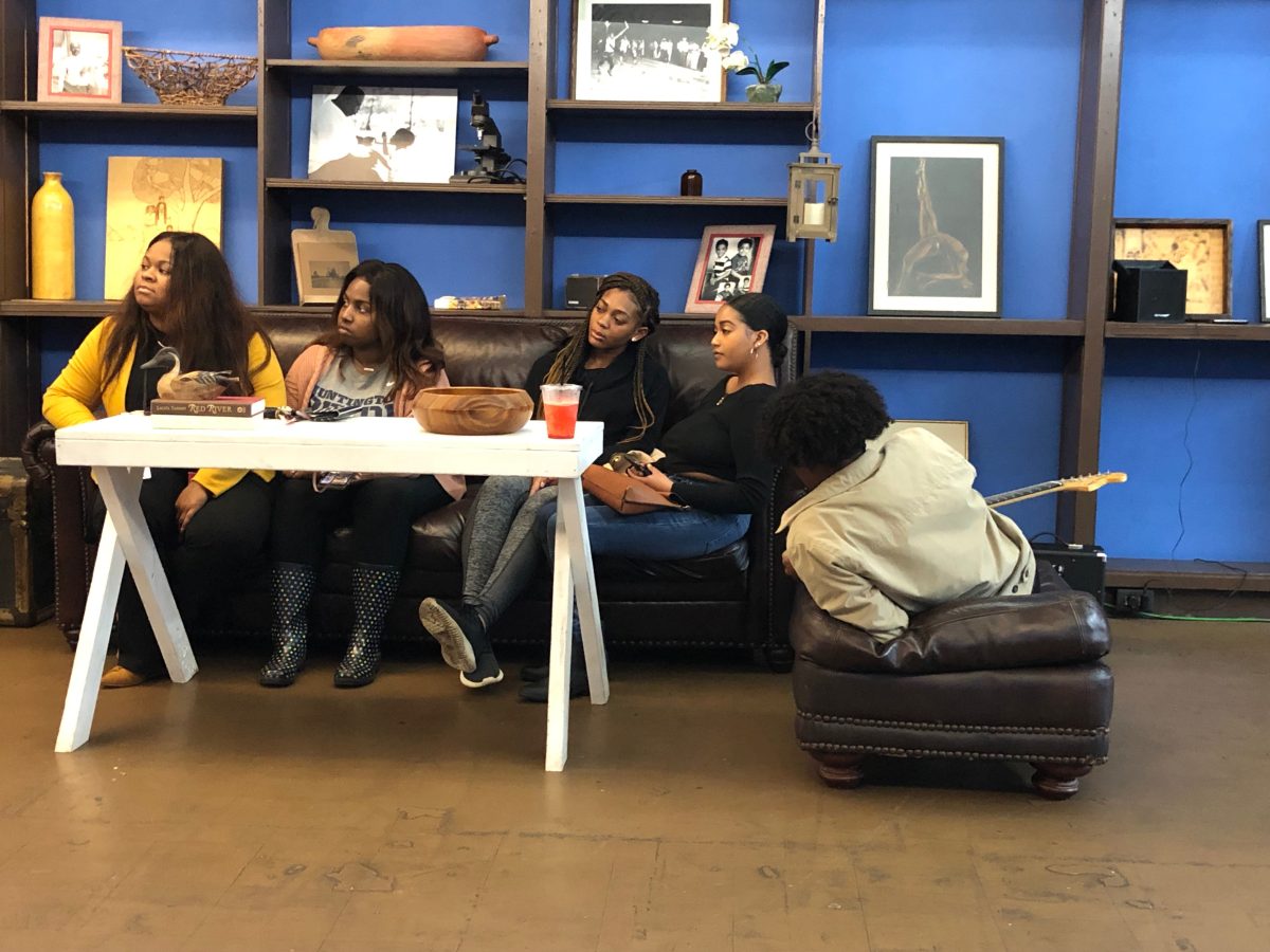 Southern University students sit in the crowd during the Poetry Slam Event hosted by the English Club on Thursday, April 4 at Southern Grind Cofe. (Khidhr Al-Mustafa/DIGEST)