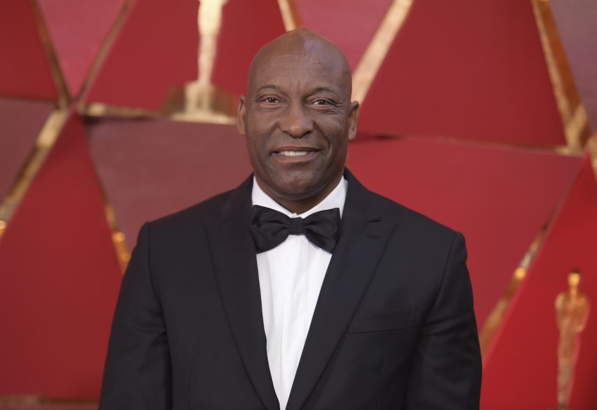 FILE - This March 4, 2018 file photo shows John Singleton at the Oscars in Los Angeles. Oscar-nominated filmmaker John Singleton has died at 51, according to statement from his family, Monday, April 29, 2019. He died Monday after suffering a stroke almost two weeks ago. (Photo by Richard Shotwell/Invision/AP, File)