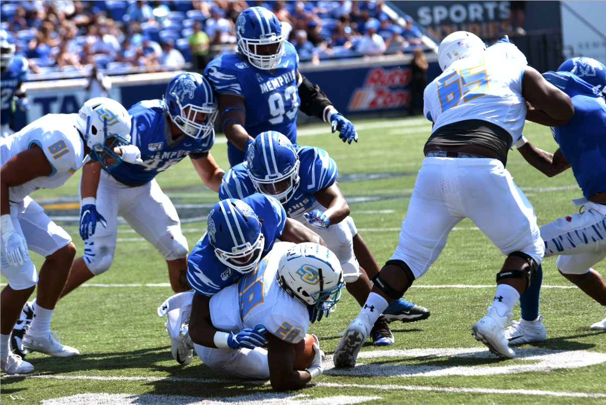 Junior receiver, Chris Channing, gets taken down by a host of University of Memphis defenders at Liberty Bowl stadium on September 7.&#160;Keith Lewis/DIGEST