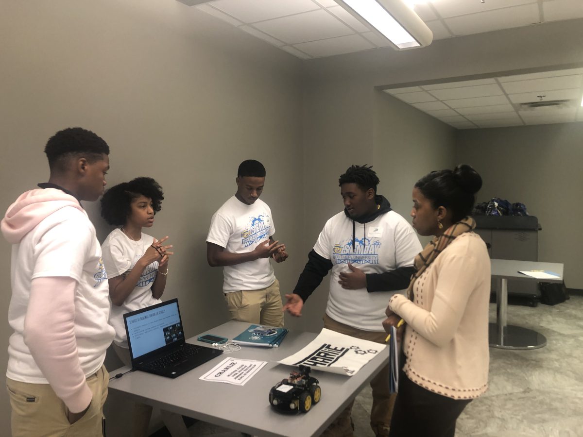 A group of high school students chat&#160; with Assistant Professor in the College of Sciences, Dr. Lynette Jackson about promixity sensors in vehicles during STEM day held on Friday, November 15 inside the PBS Pinchback Engineering Building. (Dante Davis/DIGEST)&#160;