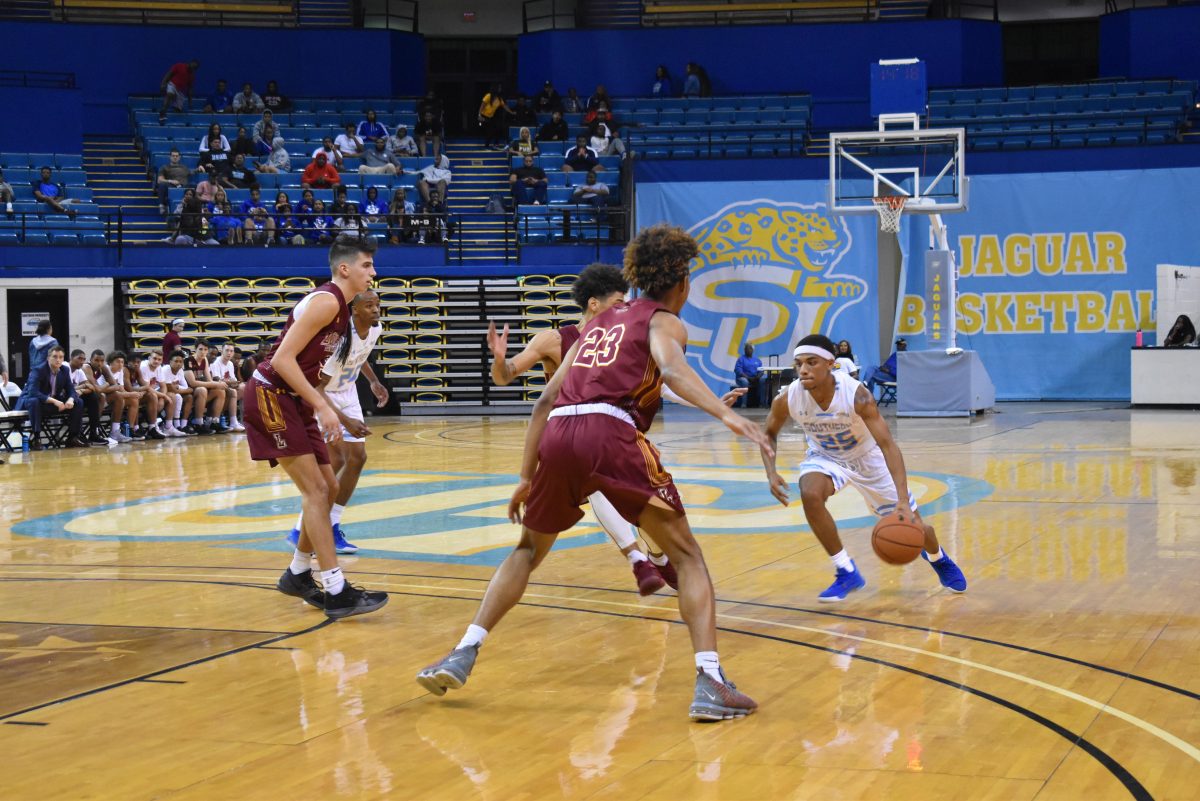 Redshirt Junior, point guard, Brendon Brooks, works his way through two Loyola defenders during the SU vs Loyola game Wednesday, November 6. (Tiffany Williams/DIGEST)