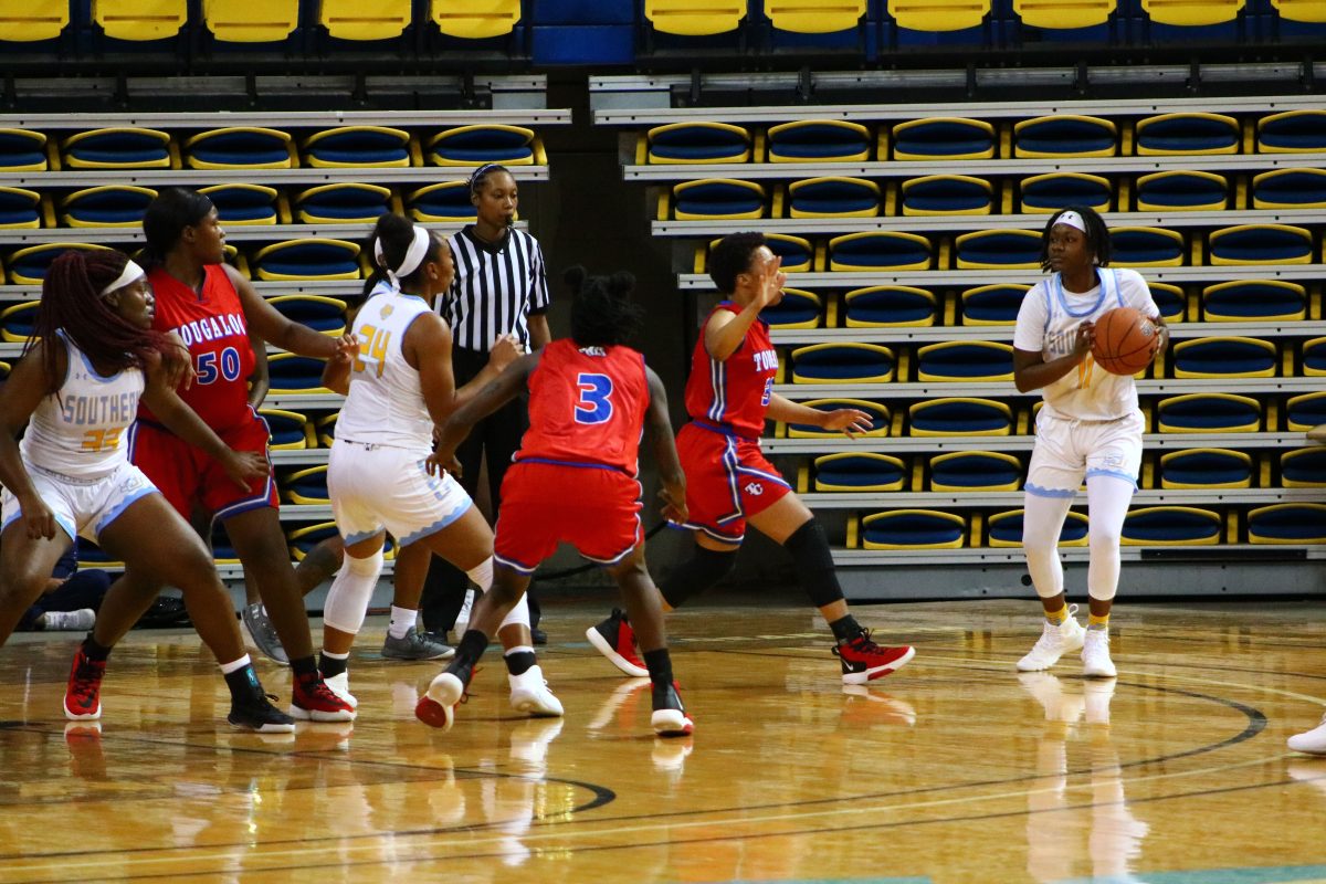 &#160;Senior guard Brittey Rose prepares to make the pass during the Jaguars game against the Tougaloo college bulldogs on Wednesday November 13. (Kyndall Jones/DIGEST)&#160;