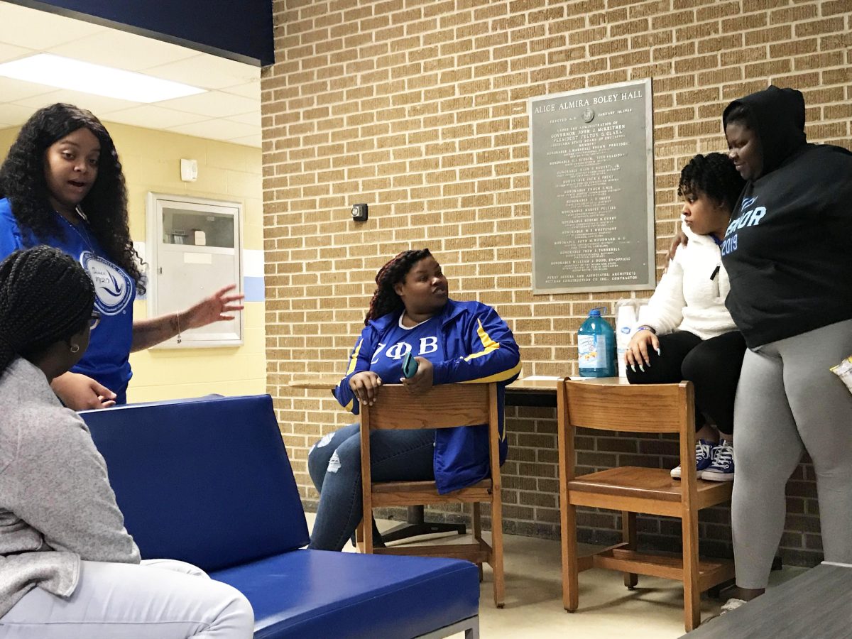 The ladies of the Beta Alpha chapter of Zeta Phi Beta Sorority, Inc. engage in conversation at their Apollo Night held inside Boley Hall on Friday, January 31. (Te&#8217;yanah Owens/DIGEST)