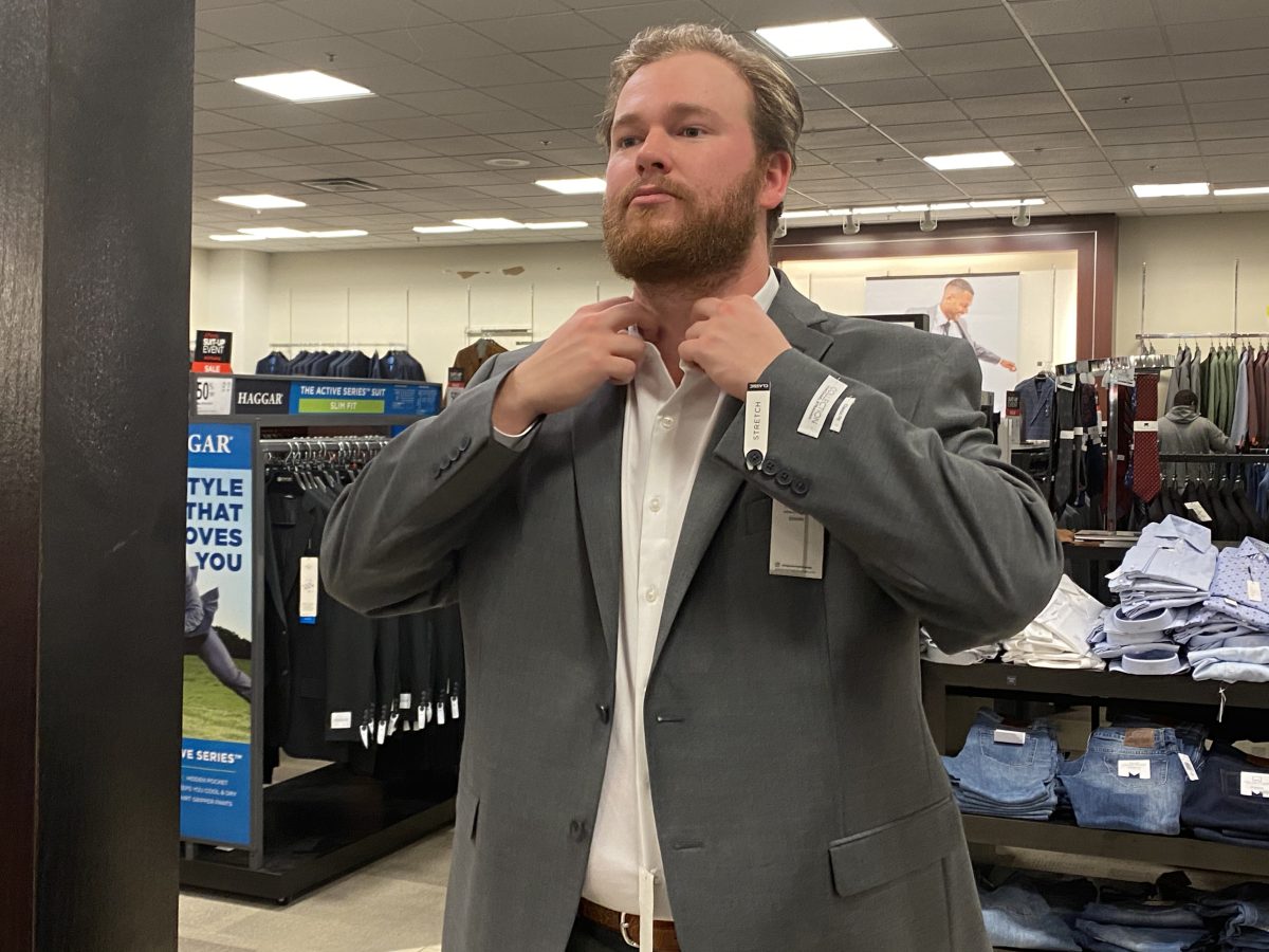 First year law student, Jack Griffin of Bossier City tries on a suit during the "Suit Up for Success" event hosted by SU Career Services, held Sunday, February 16 at JCPenneys inside the Mall of Louisiana. (Tiffany Williams/DIGEST)