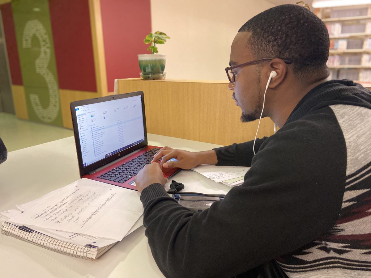 Junior, Social Work major Markeith Stepter prepares himself for exam week while on the job on March 4. (KIYANNA GIVENS/DIGEST)