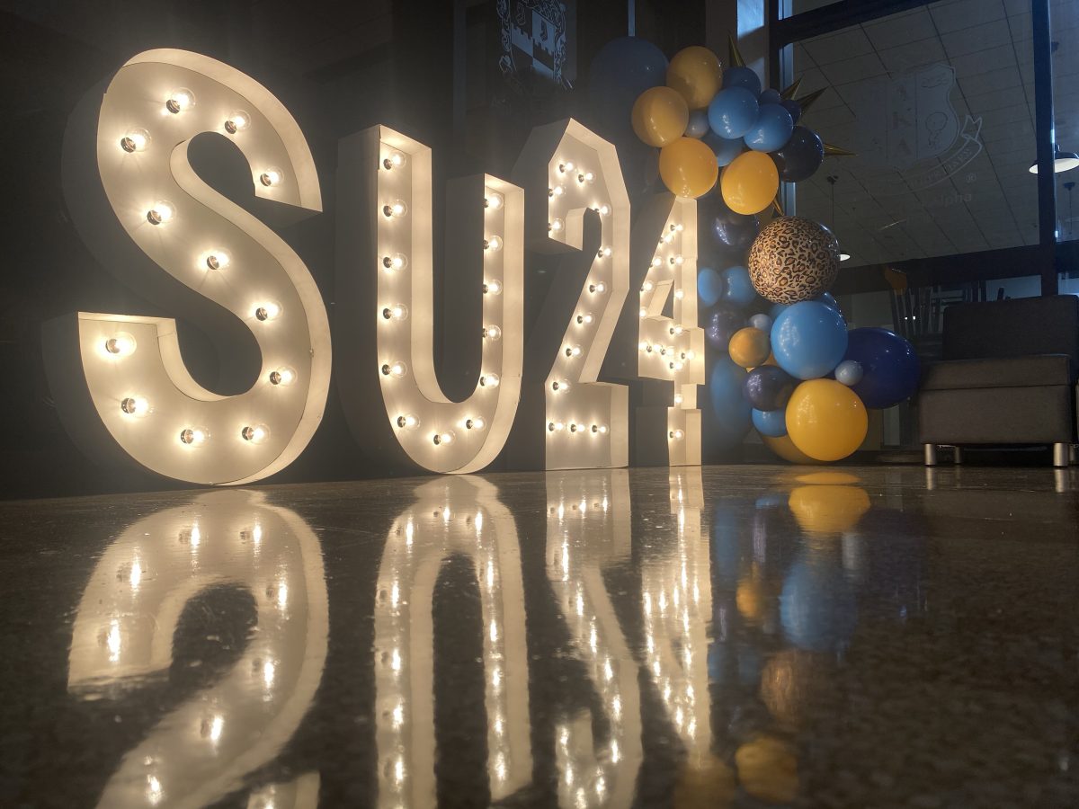 Lighted signage and decor setup in the lobby of the Smith-Brown Memorial Union to welcome the class of 2024 during 365 Orientation.