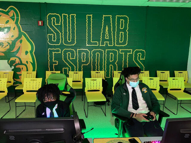 Southern University Lab's students Tyler Wallace and Dacorion Marioneaux utilizing their new gaming equipment at the Grand Opening of Esports and Media Lab on January 28. (Te'yanah Owens/DIGEST)