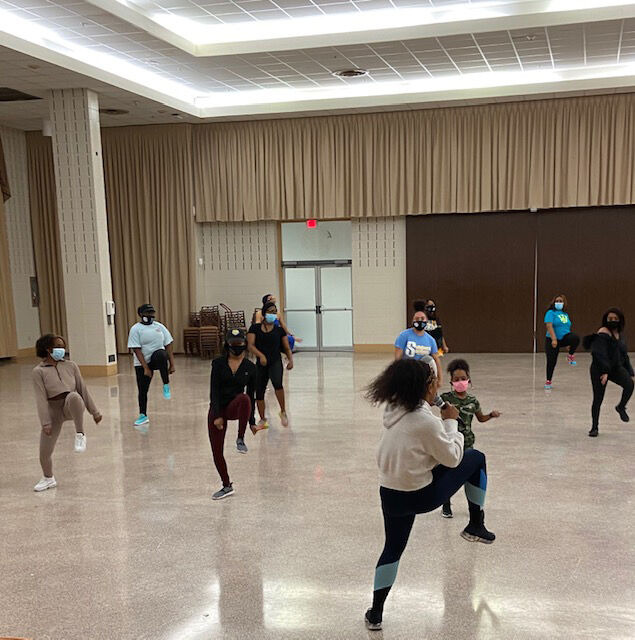 Former SU Fabulous Dancing Dolls Captain Airee Renee instructing students dance moves at Miss Junior's Bounce and Burn held inside the Union's Ballroom on February 24. (Te'yanah Owens/DIGEST)