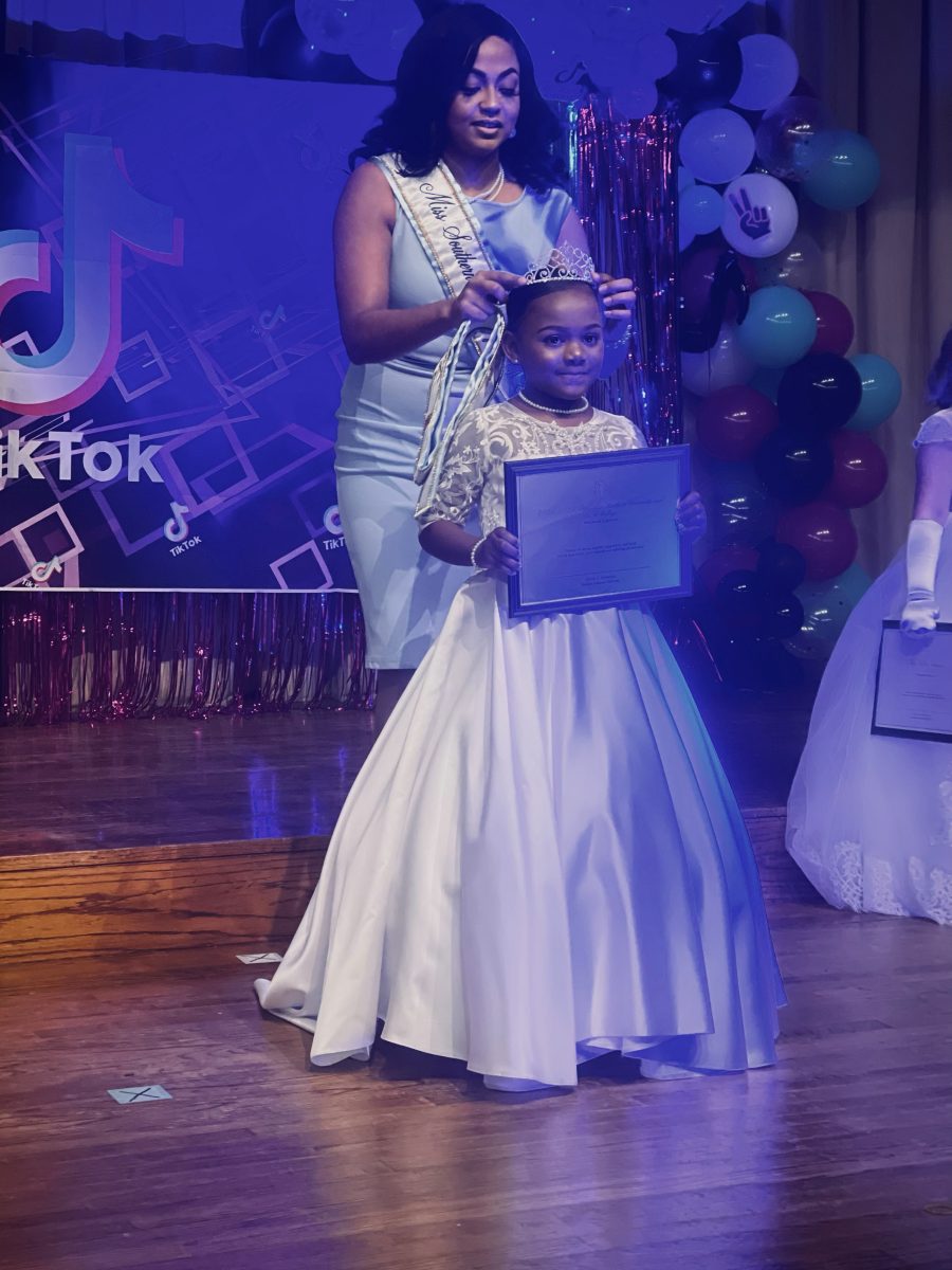 <p>Little Miss SU contestant Zayah Symonee Cooper is speechless as she is crowned the 2021-2022 Little Miss. Southern by the 91st Miss Southern University, Jaden Johnson. (Terrell Smith/DIGEST)</p>