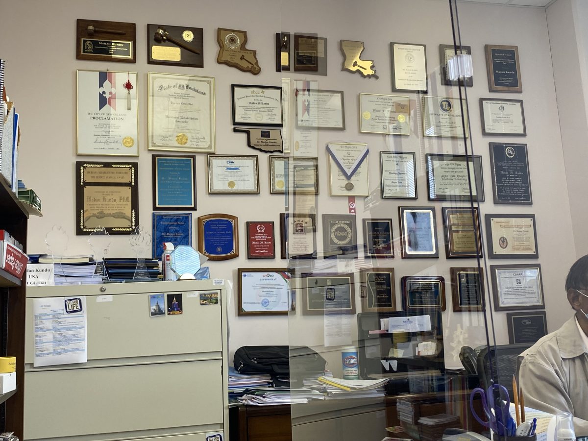 A collage of awards/credentials that sit on the wall inside Dr. Madan M.Kundu&#8217;s office inside the Office of Disability Services.(Whitney Thomas/DIGIEST