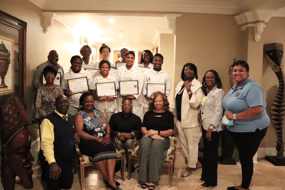 Members of the Southern University Alumni home chapter smile for a quick photo with students from theSouthern University Nursing Program after their pinning ceremony on Thursday, October 14 inside theWade House. (Keith Davis/DIGEST)