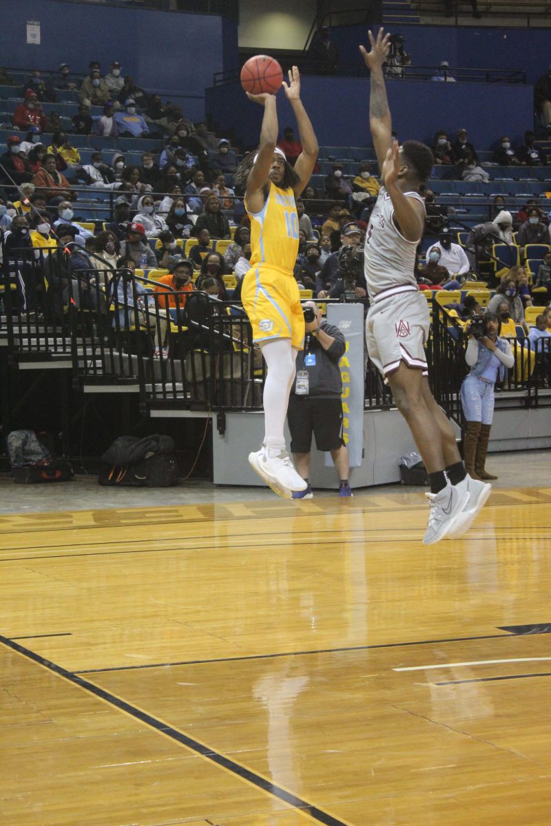 Junior, Guard, Delor Johnson shoots a 3 pointer in the first quarter of the Men&#8217;s Basketball game against Alabama A&amp;M University in the F.G. Clark Center, February 5. (Tiffany Williams/DIGEST)&#160;&#160;