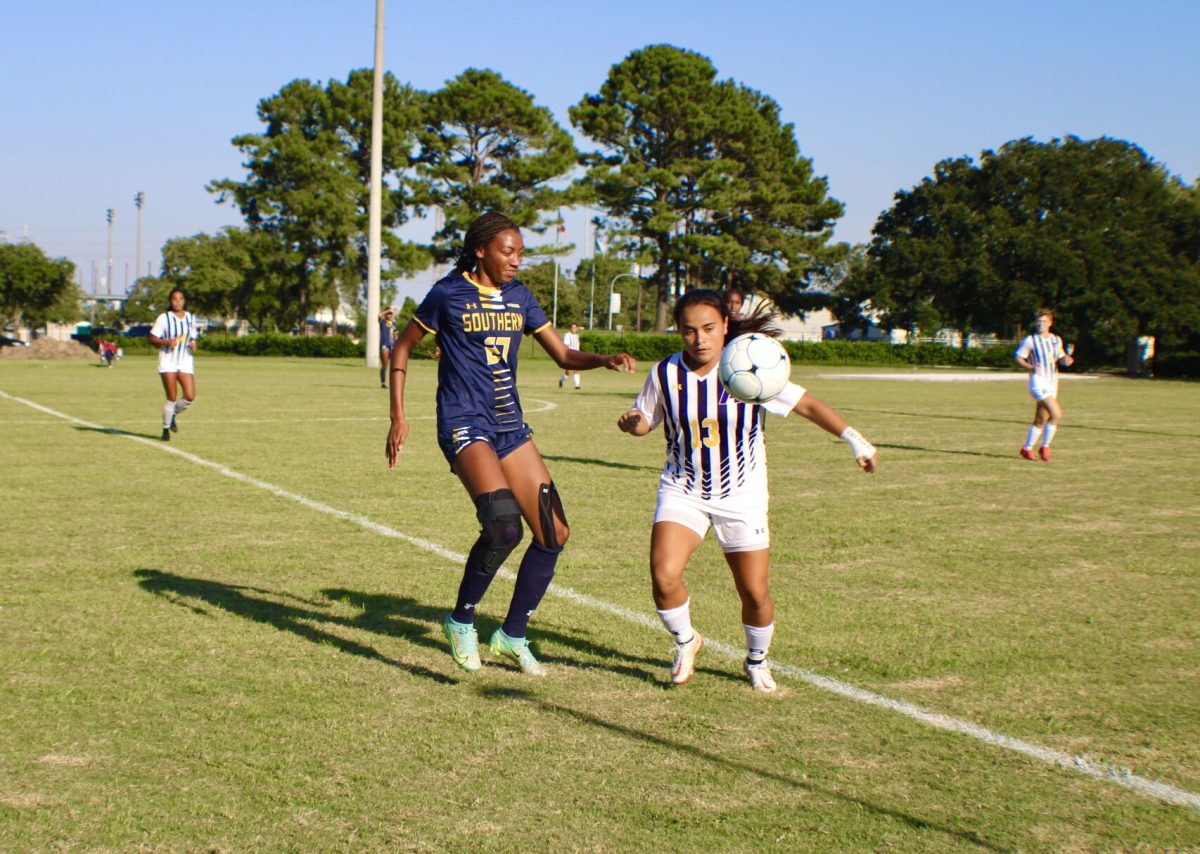 Junior, Alyssa Terry maneuvers the ball around an LSUA defender. (Taylor Haywood)