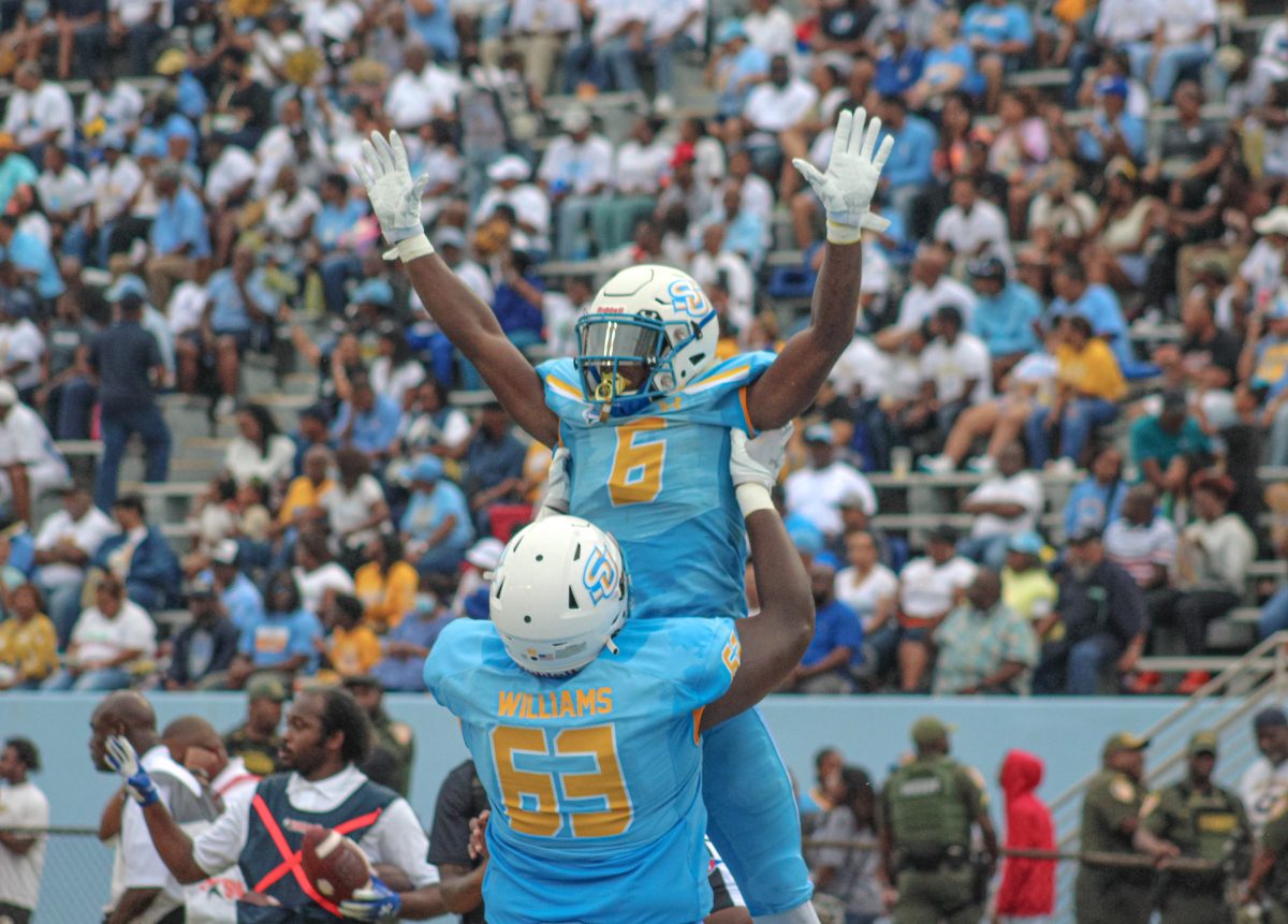 Freshman Running Back Kendric Rhymes celebrates with Redshirt Senior Offensive Lineman Brian Williams during the Pete Richardson Classic against Florida Memorial University. (Devin Wash/Southern Digest)