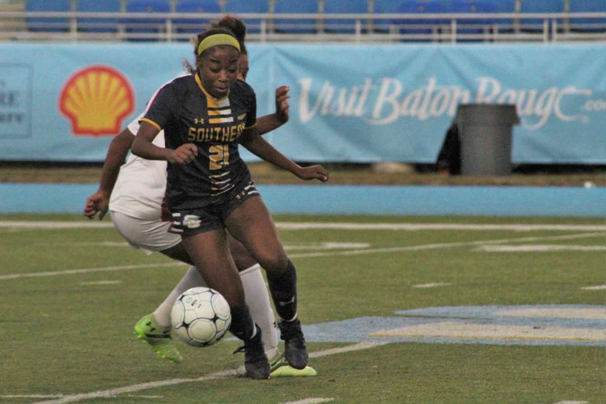 Junior, Middle Defender, Alayla Jackson dodges a Jackson State defender to resecure the ball.&#160;&#160;