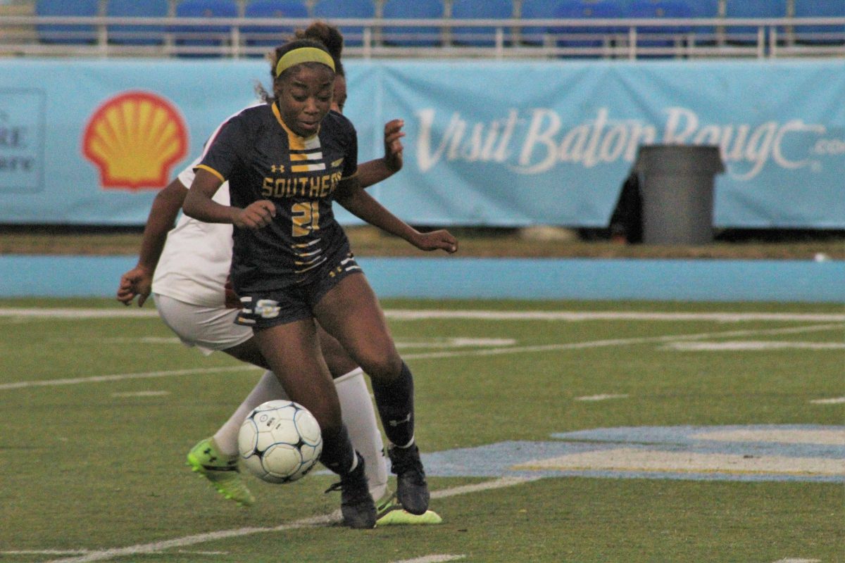 Junior, Middle Defender, Alayla Jackson dodges a Jackson State defender to resecure the ball.&#160;&#160;