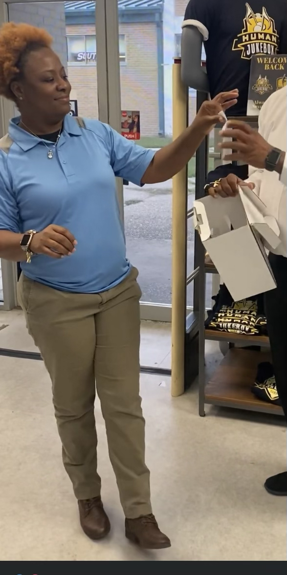 Southern University Bookstore Manager, Deshawn Jones, greets a customer inside the campus bookstore .Debrandin Brown/DIGEST)