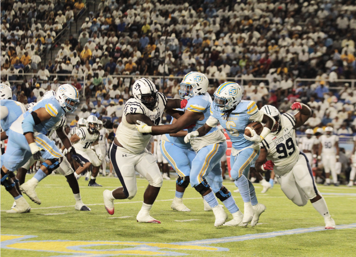 Sophomore Kendric Rhymes looks for a hole in the Jackson State defensive during the SU Vs. JSU game in Saturday, September 9 inside A.W. Mumford Stadium.&#160;