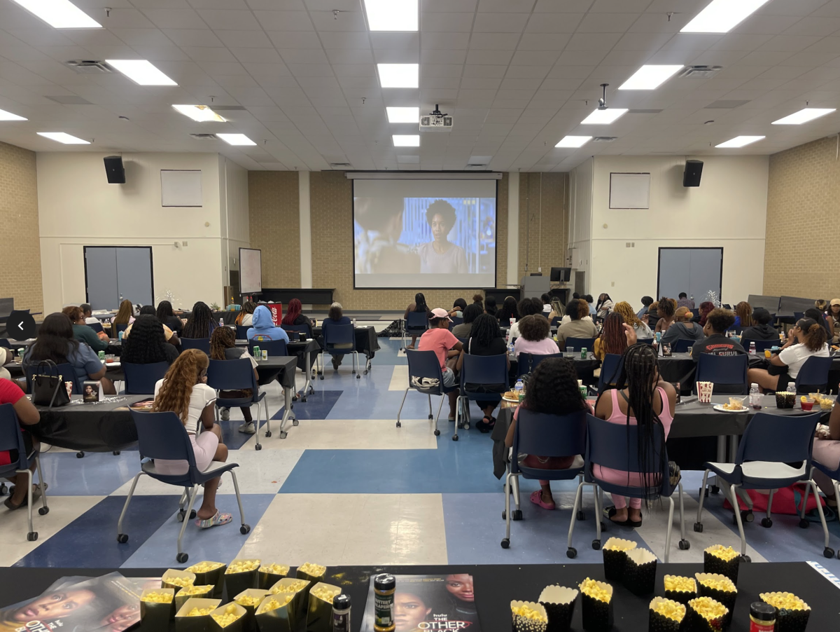 Students enjoy refreshments by The Bayou Effect while watching the premier of "The Other Black Girl" on Hulu in Stewart Hall Auditorium.