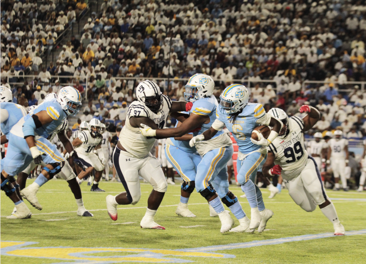 Sophomore Kendric Rhymes looks for a hole in the Jackson State defensive during the SU Vs. JSU game in Saturday, September 9 inside A.W. Mumford Stadium.&#160;