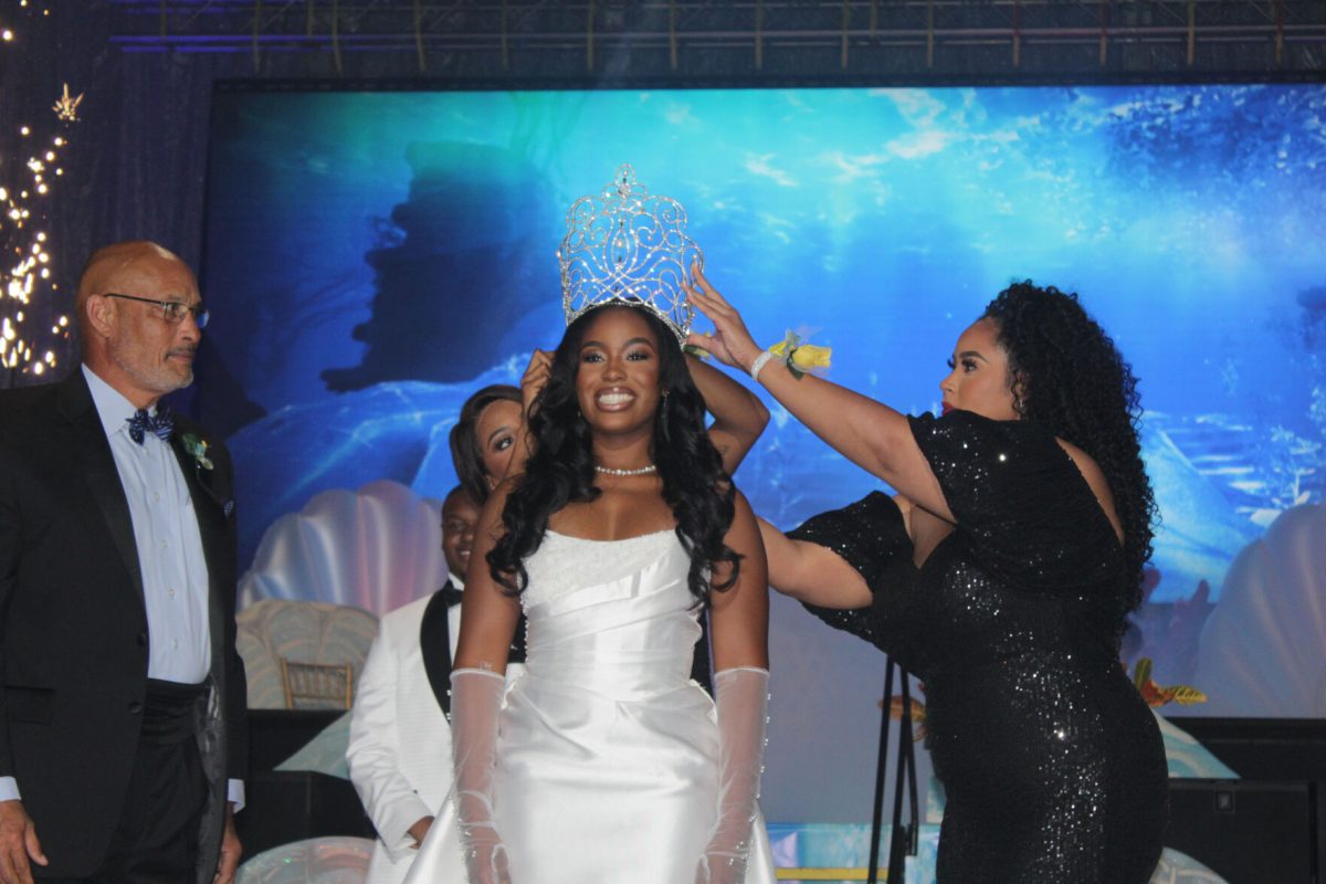 SUS President, Dennis Shields on looks as Jordan Williams is crowned for the first time as the 93rd Miss Southern since her electon last spring during Coronation, on Wednesday, October 11 in the F.G. Clark Center.&#160;