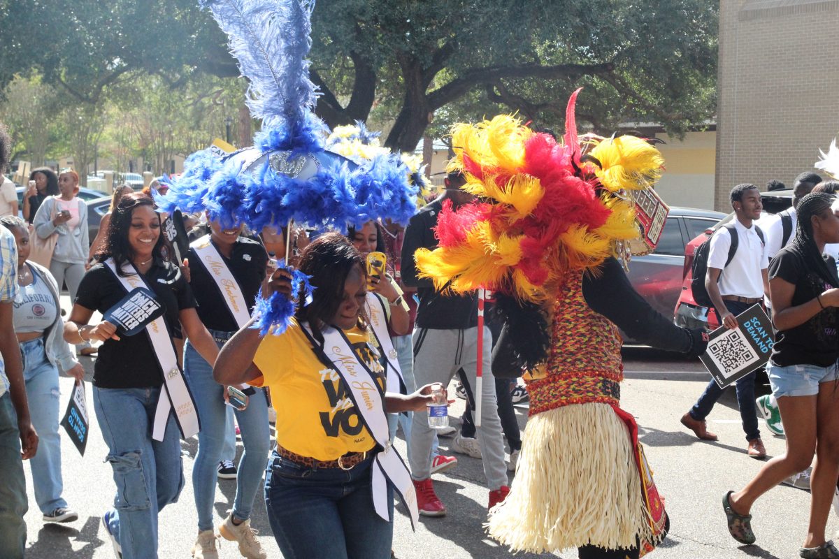 Southern student enjoying themselves while traveling the second line route held on campus to encourage students to vote during NAACP's Votecoming week.&#160;