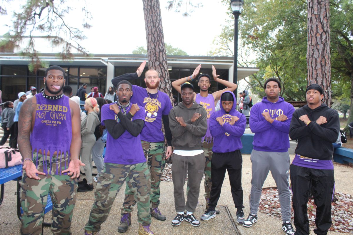 The Beta Sigma chapter of Omega Psi Phi Fraternity Inc. pose for a picture duing their Yard Show event apart of the week they planned leading up to thier founders day.&#160;