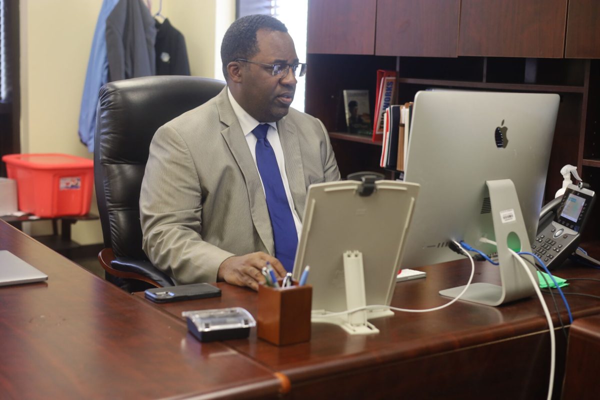 Dr. Anthony Jackson browses through emails as he starts his day.