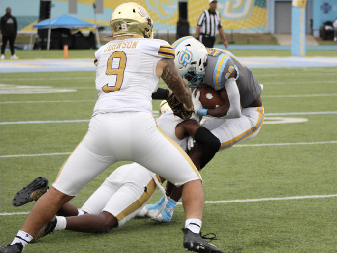 Graduate Student, wide receiver, August Pitre III gets tackled by Prairie View's Devon Cooper during the Jaguars SWAC West matchup on Saturday, November 11 inside A.W. Mumford Stadium.