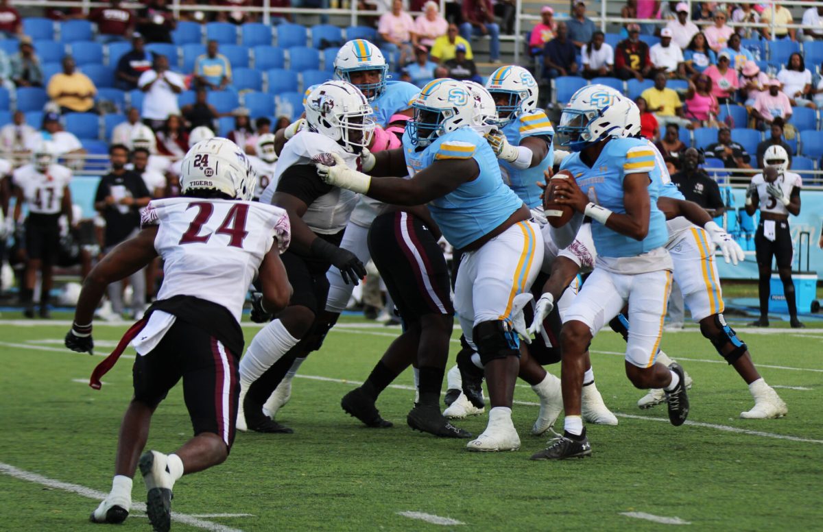 Quarterback, Harold Blood looks for an open teammate to catch the ball while being protected by O-Line at the SU vs. TXSU game this past weekend. (Taylor Haywood/ DIGEST)