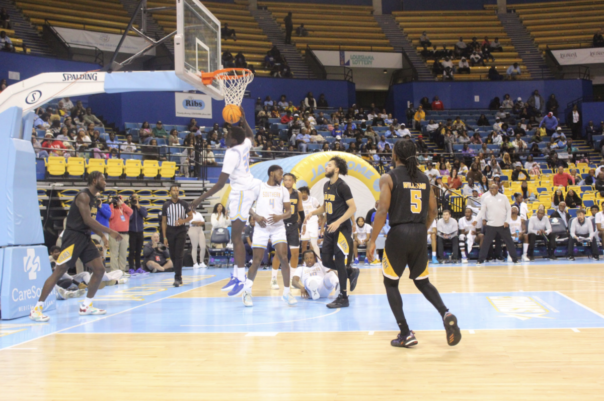 Freshman forward, Delang Muon, retrieves the rebound from an unmade shot from a player from UAPB at Saturday nights game. (Kynedi Nichols/ DIGEST)