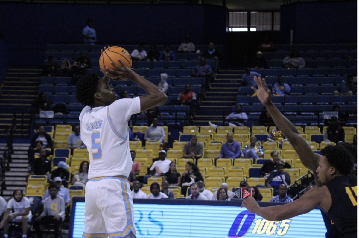 Senior Jariyon Wilkins rises up for a shot over Bethune-Cookman defenders. 3/2