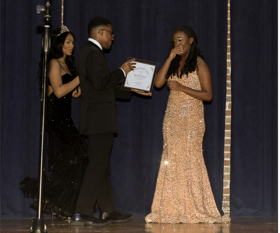 Faith Alexander smiles as shes crowned the 2024-2025 Miss NAACP at the conclusion of the pageant on Friday, March 22.