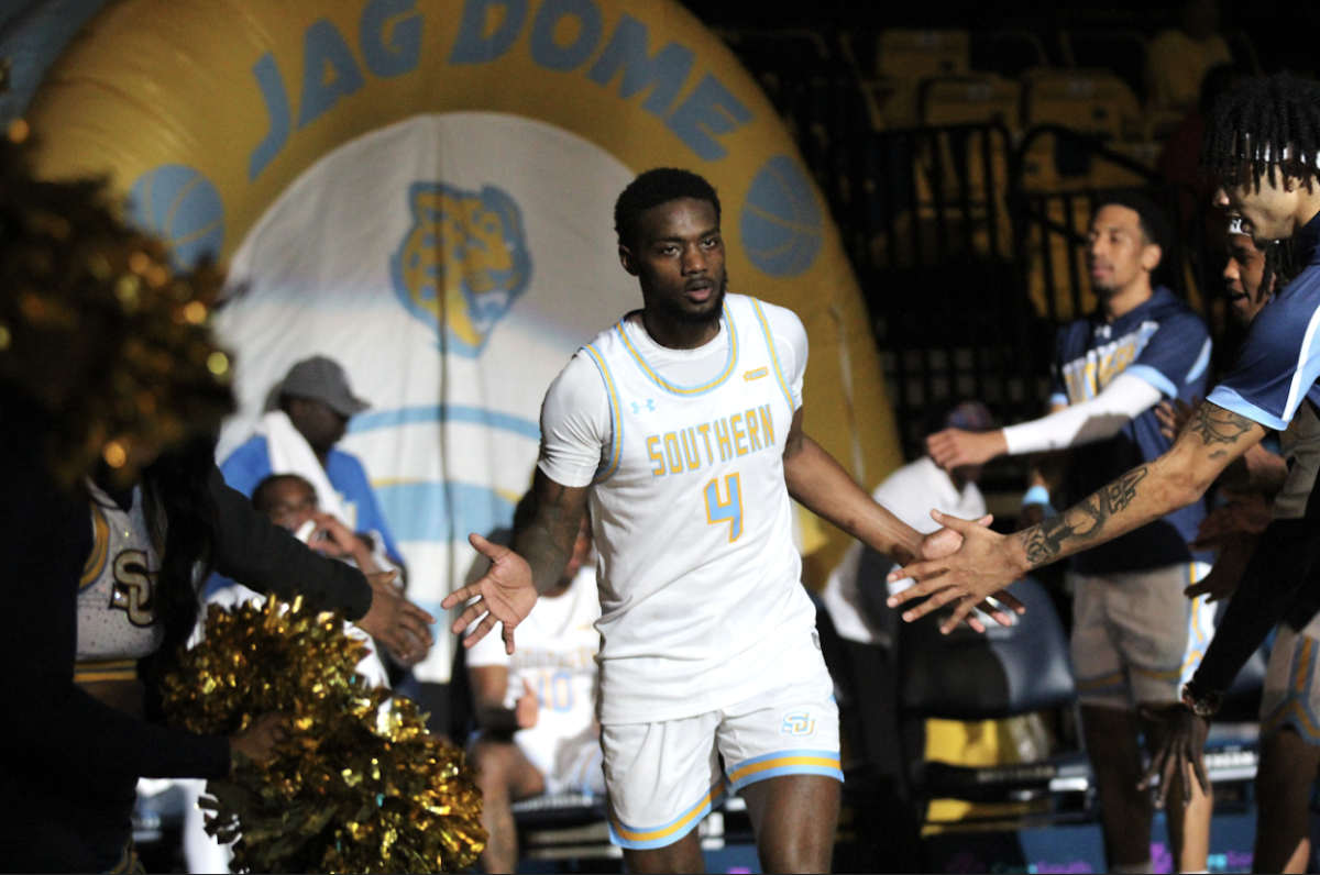 Guard Derrick Tezeno running out in the opening line up introducton against FAMU at clark activity center on March 4