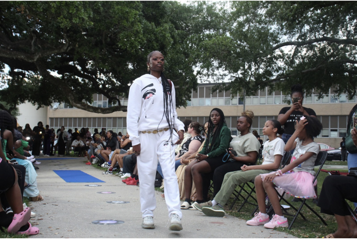 At the Rhythm x Threads Fashion Show students model fashion brands on campus outside of Pinkie Thrift Hall.