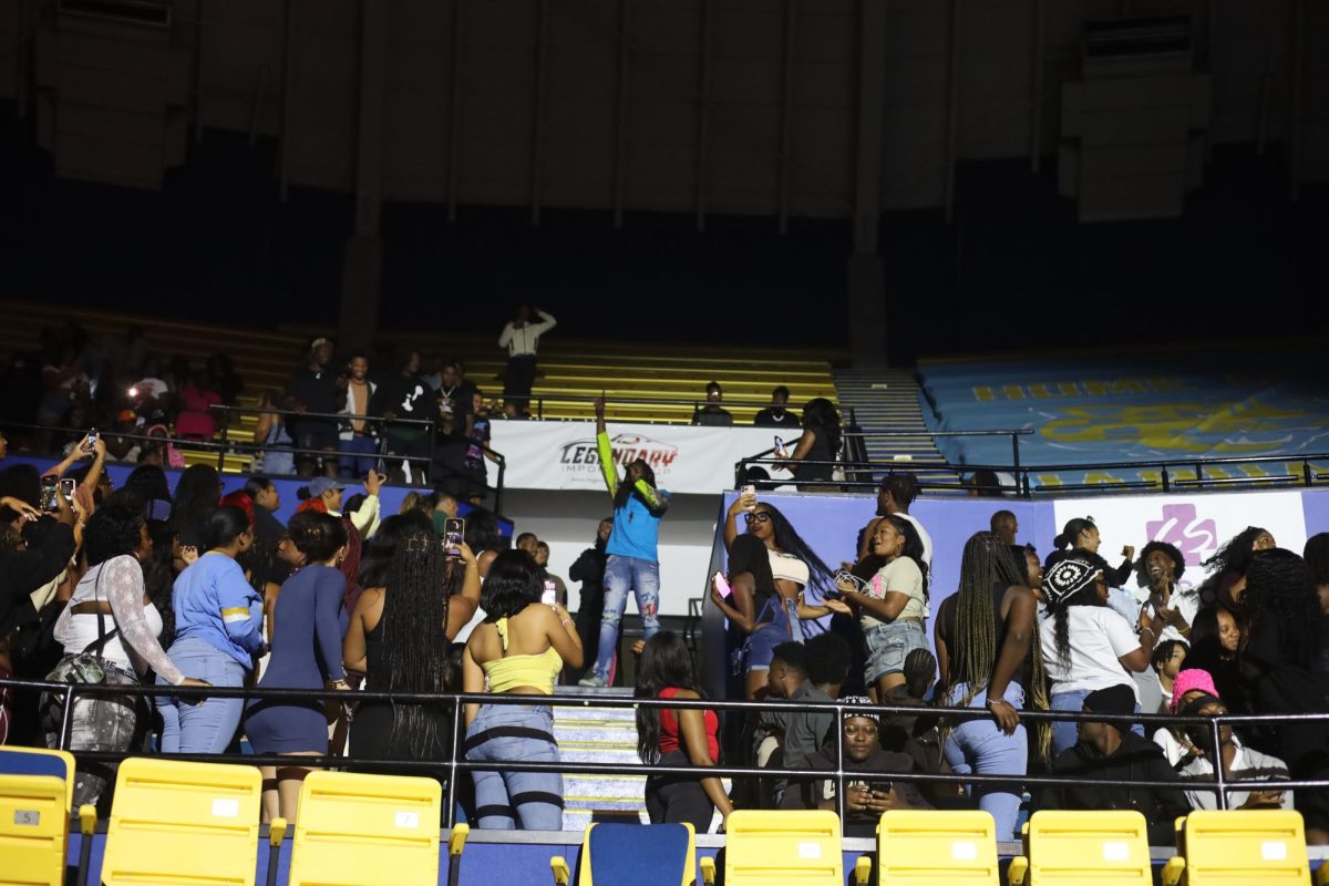 Comedian Blaq Ron ends his set at the comedy show in the bleachers with the students in the F.G. Clark Activity Centeron October 14. 