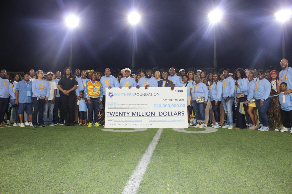 Members of the Southern Foundation present a check to all Southern University System campuses at the Homecoming game at A.W. Mumford on October 19.