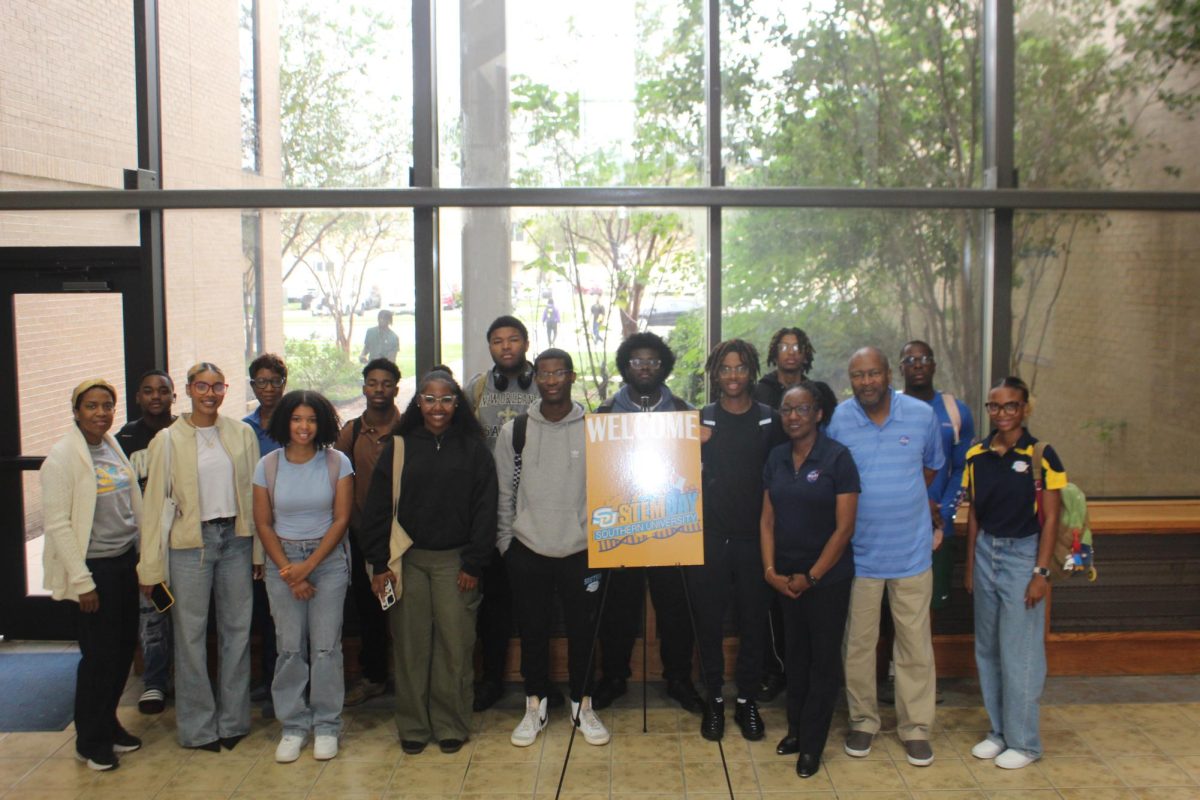 Students pose for a picture at STEM Day hosted by the SU College of Sciences and Engineering in P.B.S. Pinchback Hall on November 8. 