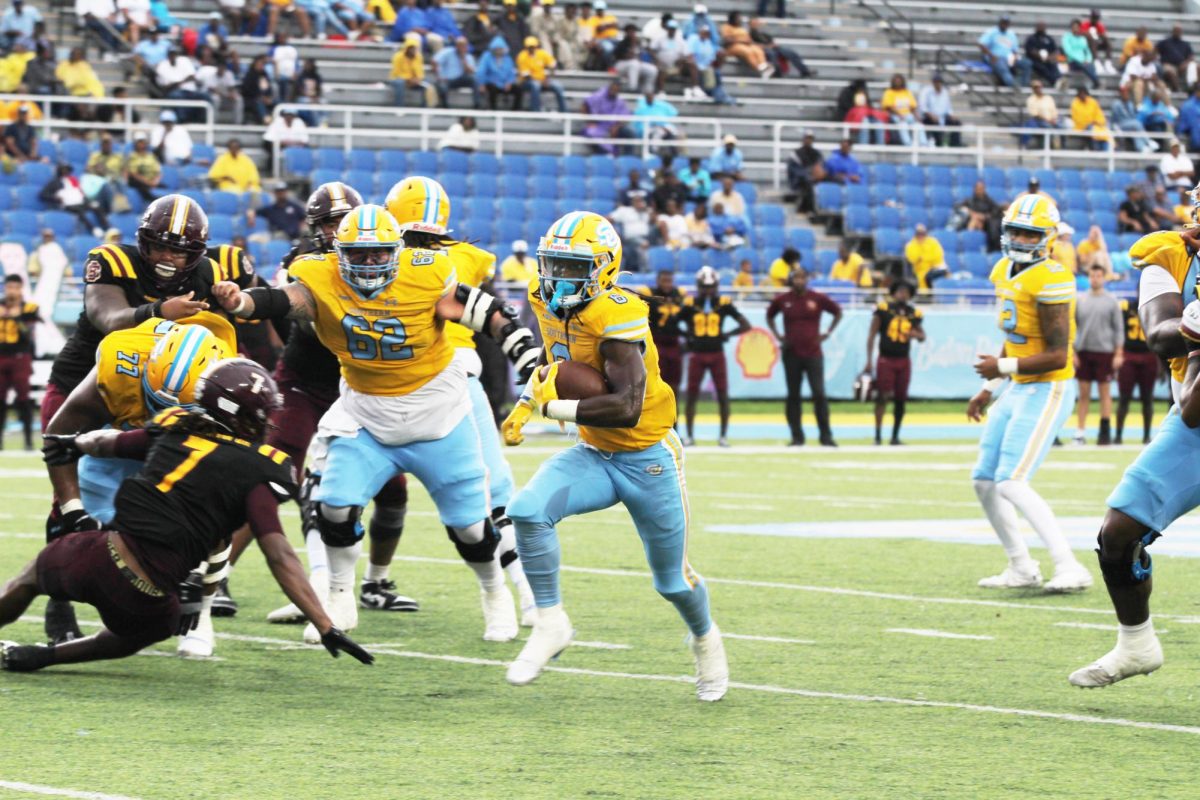 Senior, running back, Kendric Rhymes runs for a positive gain against Bethune Cookman on Saturday, November 9.