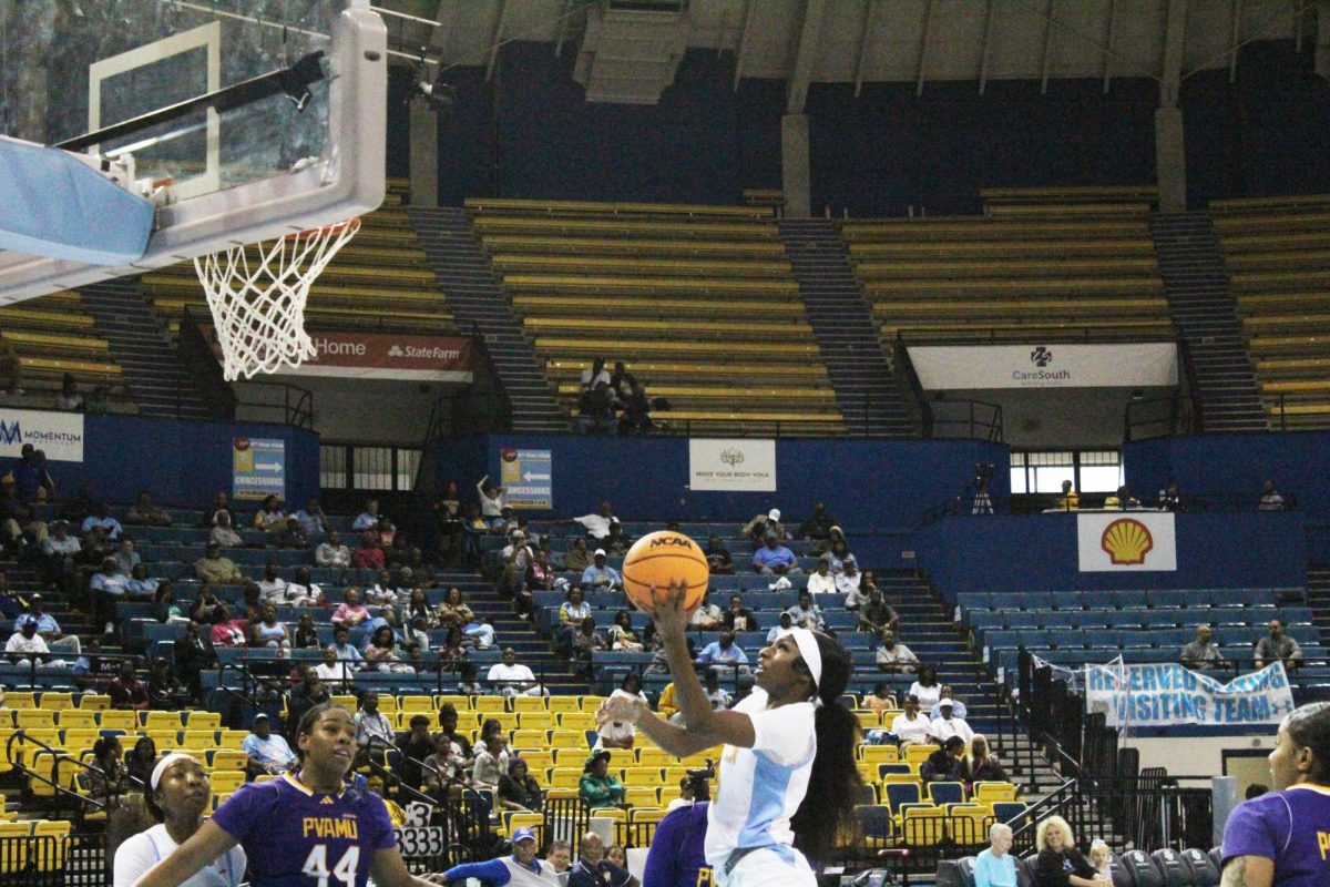 Freshman, guard, Jocelyn Tate, drives to the basket past two Panther defenders during their match-up with Prairie View on Saturday, February 15 at the F.G. Clark Activity Center.