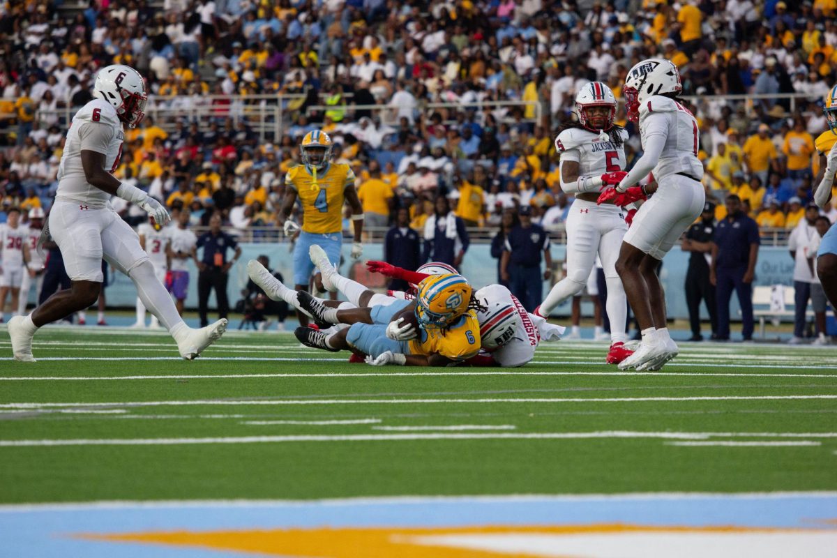 Red Shirt Sophomore, Trey Holly is tackled by Jackson State's  B.J. Washington during the annual Boom Box Classic on Saturday, September 27 inside A.W. Mumford.