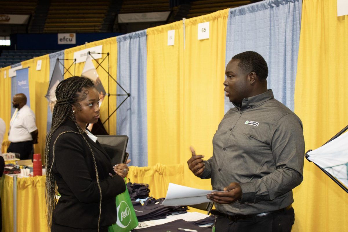 Senior Nyla Reiss talks to Enterprise Inc. during the Career Fair geld in the F.G. Clark Activity Center on September 24. 