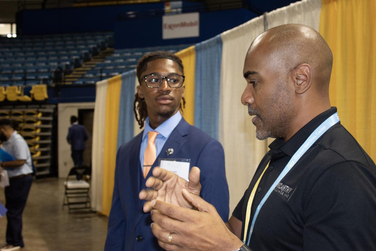 Sophomore Kayden Thompson talks to McCarthy Constuction during the Career Fair at F.G. Clark Center on September 24.