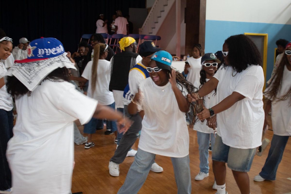 Students enjoying the decades themed pep rally inside the University Event Center on Friday, September 26.