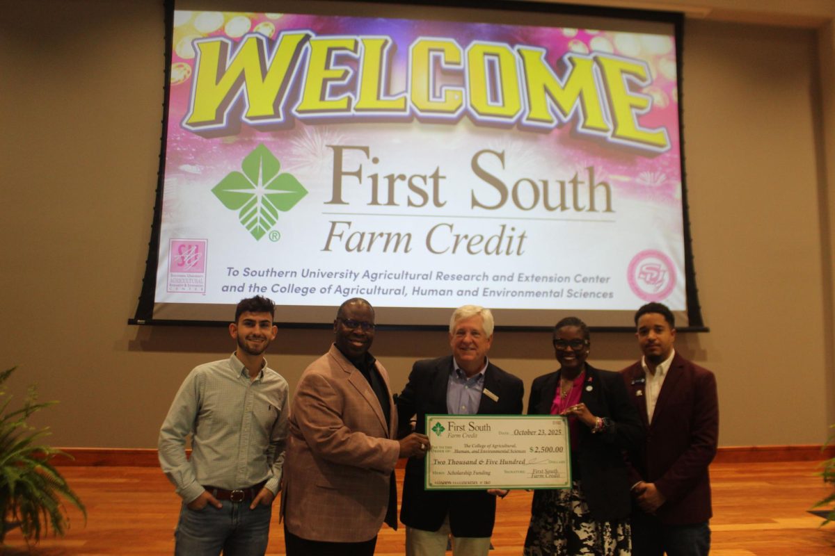 The Chancellor-Dean and other admin from the Agriculture Department accepts the generous donation from First South Farm Credit Bureau after their financial literacy workshop on October 23 in the Valdry Center.