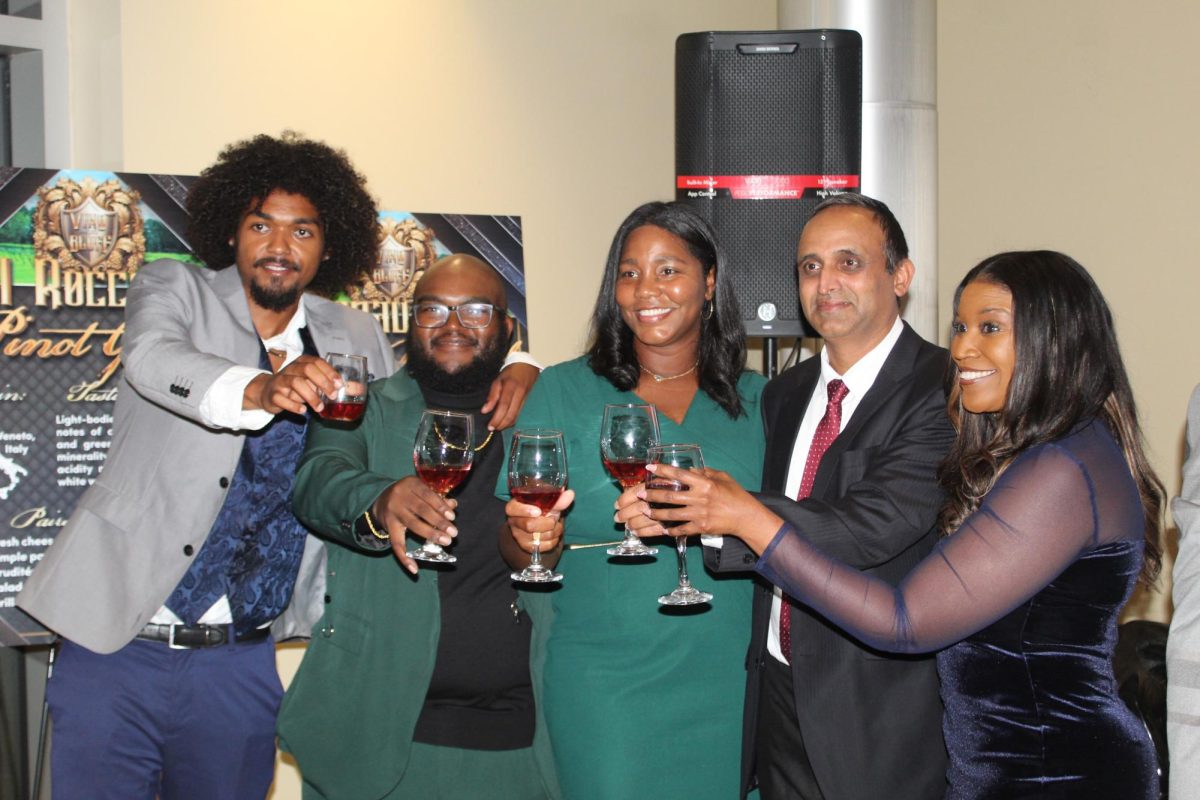 Attendees of the Southern University Agriculture "Vino on the Bluff" toasting to the launch of the new "801 Wine Collection" on October 17 at the Leon Tarver II Center. 