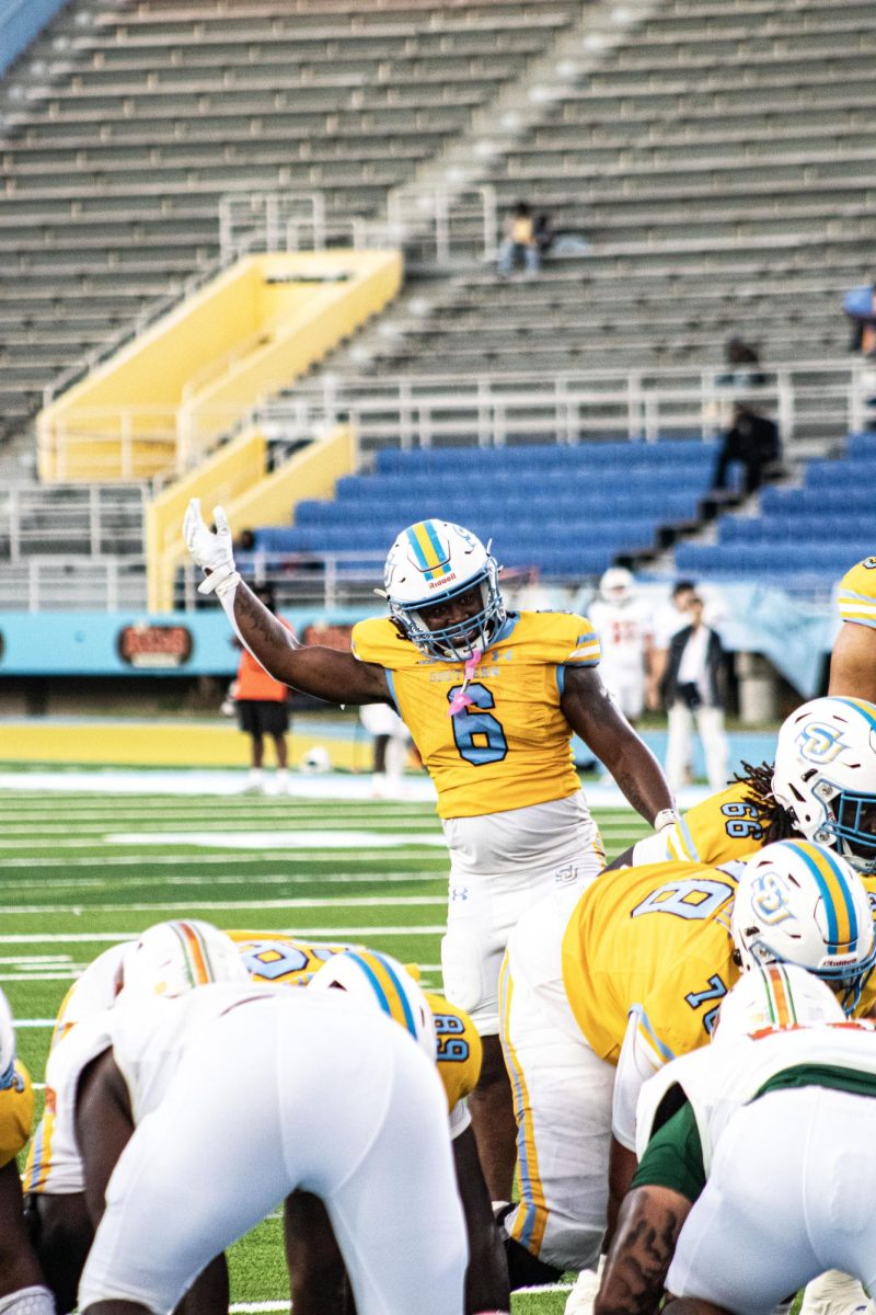 Sophomore Running Back, Trey Holly, pictured hyping up the crowd during the game against FAMU on Saturday, October 25 in A.W. Mumford Stadium.