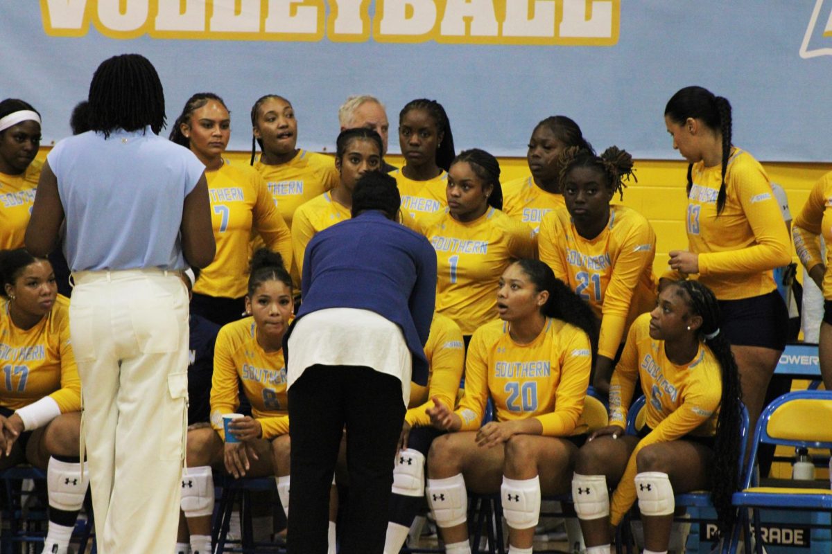 Head Coach Dawn Barnes huddles up with the volleyball team as the took on the Texas Southern University Tigers on September 29 in Seymour Gym. 